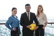 © Jack Tamrong - Male developer and two female colleagues working together at high rise office balcony