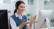 © Imagine Stuff - Woman talking with headset in office with computer; professional, help service