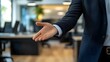 © Nita - Business Professional Extending Hand for Greeting in Modern Office
