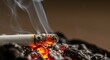 © tea - Burning Cigarette in Ashtray - Close-up of a burning cigarette in an ashtray, with smoke rising. Depicts the dangers of smoking