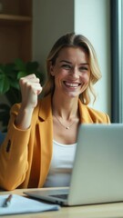 Poster - a woman sits in front of a laptop computer, focused on her work