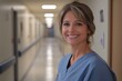 © brian - Smiling Female Nurse in Blue Scrubs - Professional Healthcare Worker Portrait in a Supportive Medical Environment