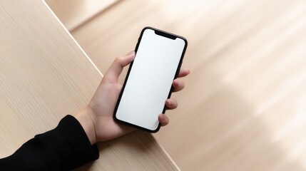 Poster - Hand Holding Blank Smartphone Over Desk, Ideal For Mobile App Promotion and Digital Marketing Campaigns : Generative AI