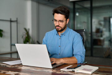 busy professional business man company employee, young male worker software developer, latin busines