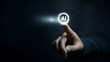 © Curioso.Photography - Close-up of a finger pressing a glowing AI icon in a dark digital environment.
