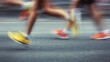 © ffunn - Close-up of the feet and legs of multiple runners in motion, running on an asphalt road, with a blurry background, low-angle shot, motion blur