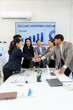 © Kritdanai - Diverse Business Team Stacking Hands in Meeting