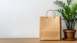 © Dian - Beige paper bag on light wood surface