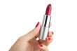 © PNG WORLD - A womans hand holds a silver lipstick tube with dark red lipstick a beautiful cosmetic product elegant makeup accessory stylish beauty item perfect for on transparent background