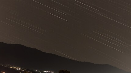 Wall Mural - Night sky star trails over mountain
