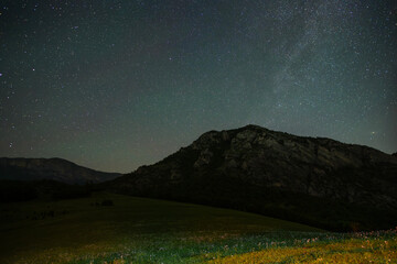 Wall Mural - beautiful night landscape, bright milky way galaxy over the mountains, starry sky.
