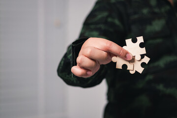 Poster - Solving puzzles military personnel action indoor setting focus teamwork concept