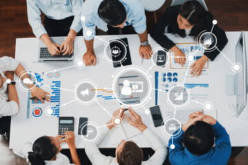 Fototapete - A dynamic marketing strategy session featuring professionals analyzing data and collaborating on innovative solutions using digital communication tools in a modern office setting. Amity