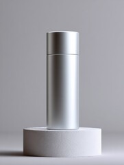 Poster - Silver Cylinder on White Pedestal Against Gray Backdrop, Ideal for Product Mockups and Minimalist Marketing Campaigns : Generative AI