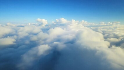Wall Mural - Continuous FPV flight through thick clouds at high altitude, offering an immersive pilot perspective. Flying over and through a white cloud on a splendid and bright sunny day. Generative AI.
