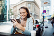 © Geber86 - Young woman using a smart phone in the city