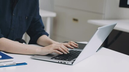Two asian team working development of programming and encryption technology website design programmers on desk in office