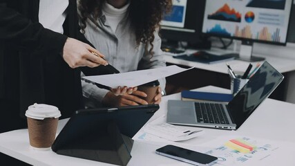 Two asian team working development of programming and encryption technology website design programmers on desk in office