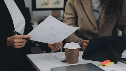 Two asian team working development of programming and encryption technology website design programmers on desk in office