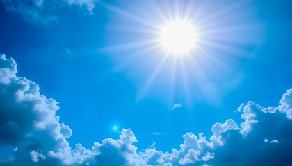 Wall Mural - A breathtaking view of a vibrant blue sky, punctuated by fluffy white cumulus clouds.  The sun shines brightly, its rays extending across the canvas.  A serene and inspiring image of nature's beauty.