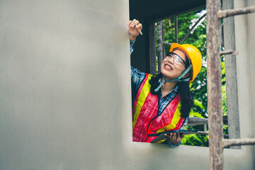 Wall Mural - Construction supervisor reviews project information and data to ensure proper compliance with plan.