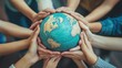© Mutimul - Hands holding a globe, representing global unity.