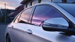 © Julia - Side view of car window tint, ceramic film provides heat rejection and UV protection with stable color, car film installed on the glass surface of the , selected focus car tinting service