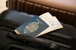 © mehaniq41 - Canadian passport with tickets lies on touristic suitcase in airport hall