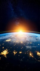 Wall Mural - Breathtaking view of planet Earth from space displaying radiant sunrise, bright city lights, and cloudy atmosphere against a starry cosmic background.