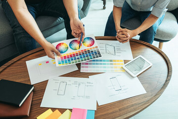 Wall Mural - team of creative web/graphic designer planning, drawing website ux app for mobile phone application 