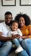 © useful pictures - A black family enjoys quality time together on a couch, smiling as the child sits comfortably in their lap, creating a warm and happy atmosphere.