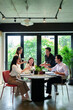 © snowing12 - Asian Business Team Enjoying Lunch Together in Modern Office Space Colleagues Sharing Meal Networking During Business Meeting Collaborative Workspace
