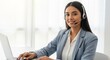 © Anna - Friendly professional woman with headset providing customer support in office environment