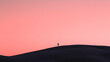 © Nabila Ayu - Silhouette on a Horizon: A Journey into Minimalist Pink Landscape Photography