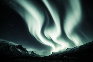 Wall Mural - A beautiful aurora with a greenish hue. The sky is dark, and the aurora is the only light source. The mountains in the background add to the serene and peaceful atmosphere of the scene