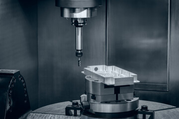 Aufkleber - CNC machine is cutting a piece of metal. The machine is very precise and has a lot of detail