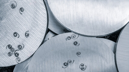 Aufkleber - Metal disks sawn by modern disk machine with shavings on the surface as background for industrial concept web banner template page design