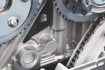 Aufkleber - close up of a car engine with the chain and gears visible. Concept of precision and complexity, as the various components of the engine work together to create motion