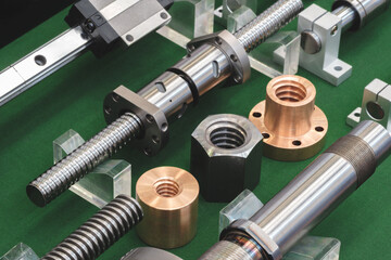 Poster - collection of gears and screws are displayed on a black background. Concept of precision and technicality, as the various parts are arranged in a neat and organized manner.