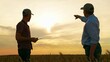 © Victoriia - Male farmers shaking hands, wheat field. Handshake, joint work of people. Business people shake hands outdoor in sun. Business teamwork. Partners agreed concluding deal, sign of consent to shake hands
