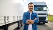 © sum - Smiling truck driver in front of a white semi-truck
