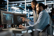 © DC Studio - Team of technicians using PC in data center, integrating AI driven automation tools, doing maintenance. Server farm coworkers using artificial intelligence machine learning models