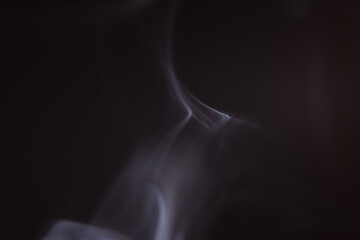 Wall Mural - macro shot of smoke vapour particles release in the air