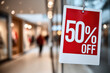 © Emanuel - 50% off sign in a store
