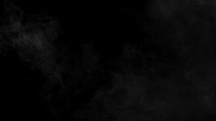 Wall Mural - delicate wisps of white fog or smoke gently drifting on a pure black background. ethereal atmospheri
