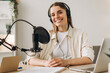 © Maria Vitkovska - Young woman recording a podcast from her home studio