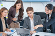 © panomporn - Laptop, professional asian business team in meeting or data analysis for group project collaboration or office employees discussing planning, business people, technology