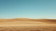 © Anastasia - Landscape photograph of a vast open field with a clear blue sky in the background. the field is covered in a golden-brown color, with the grass appearing to be dry and barren.