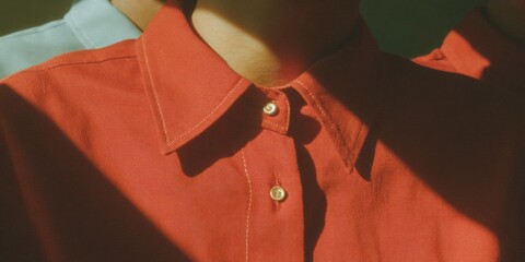 Fototapete - Corporate Redundancy Concept with Red Shirt Isolated by Dotted Line from Blue Shirts for Workforce Reduction and Organizational Restructuring Visualization