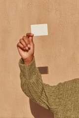 Fototapete - Contemporary Access Control Person Holding White Keycard Near Textured Wall for Secure Authentication in Modern Smart Building Environments